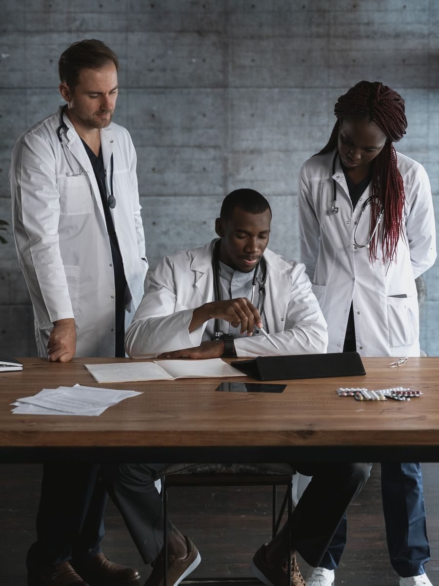 Practice team reviewing paperwork and revenue reports together