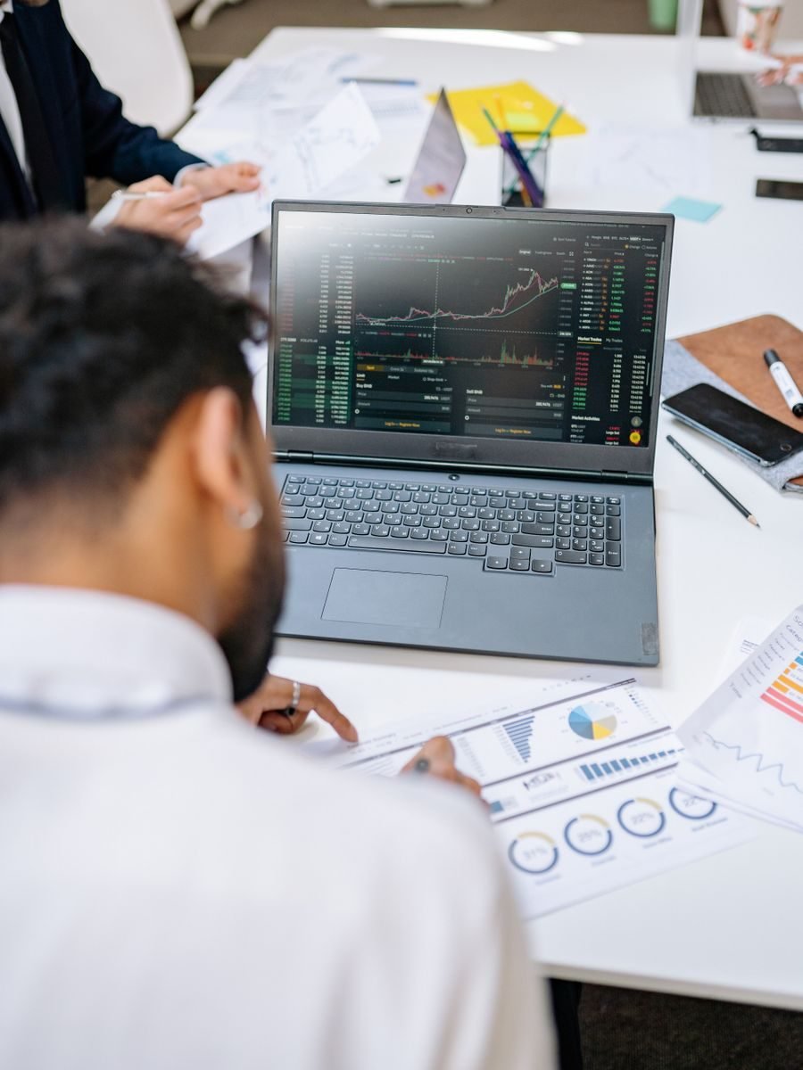 Revenue cycle analysts reviewing collection performance charts