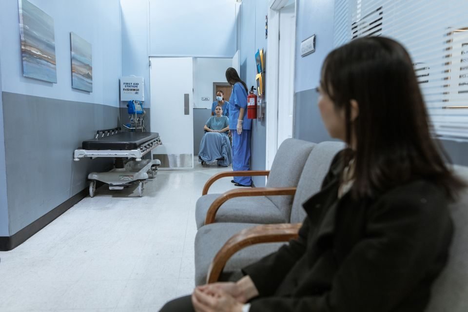 Urgent care clinic reception where walk-in patients are registered