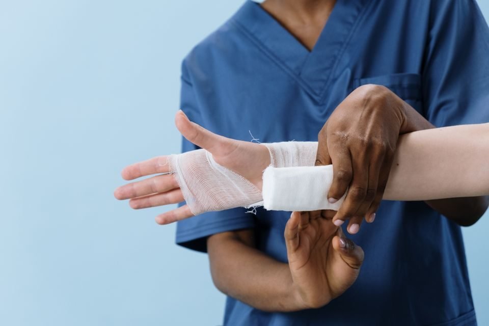 Clinician applying a dressing during a wound care treatment